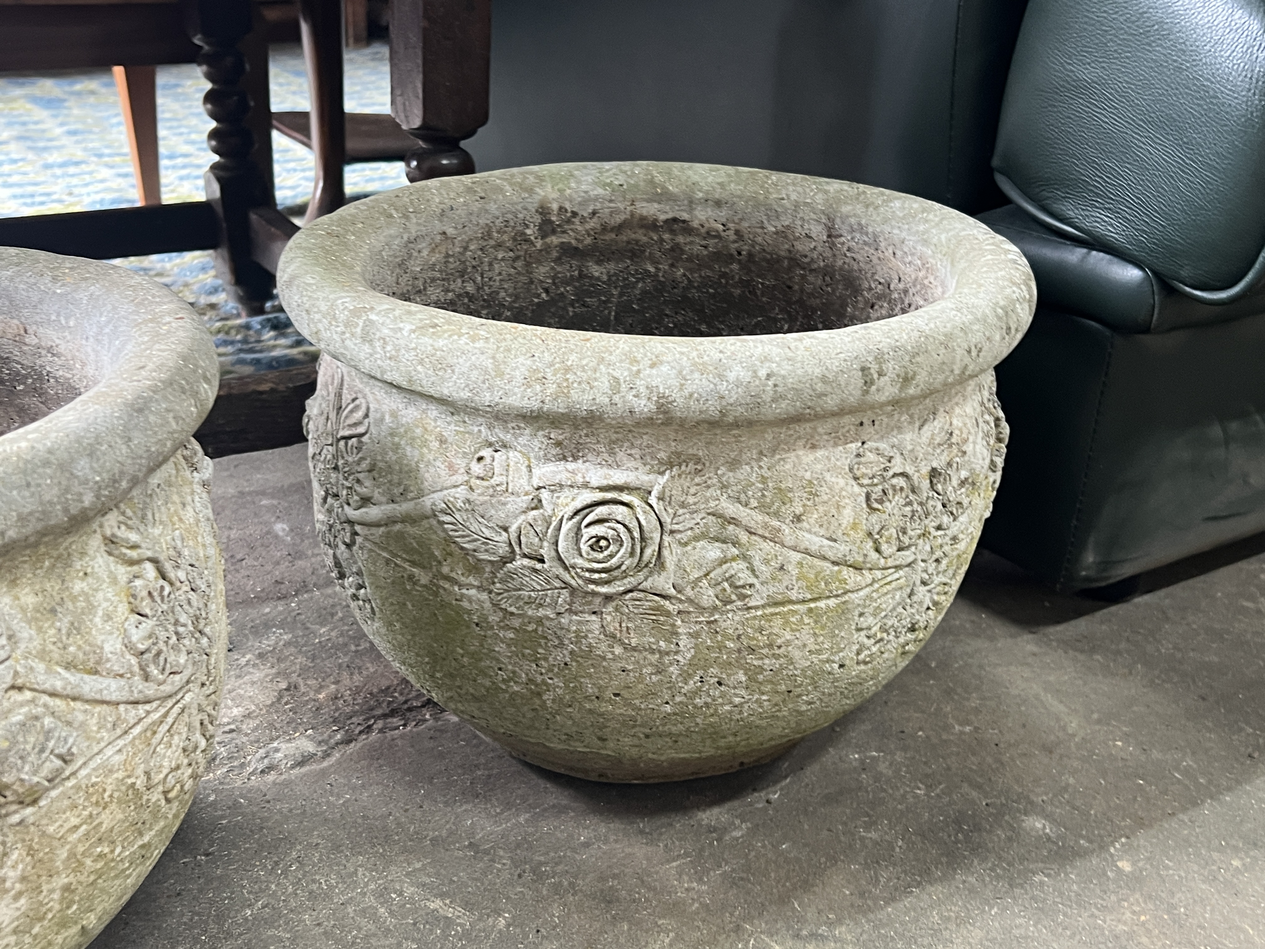 A pair of circular reconstituted stone garden planters, diameter 37cm, height 26cm